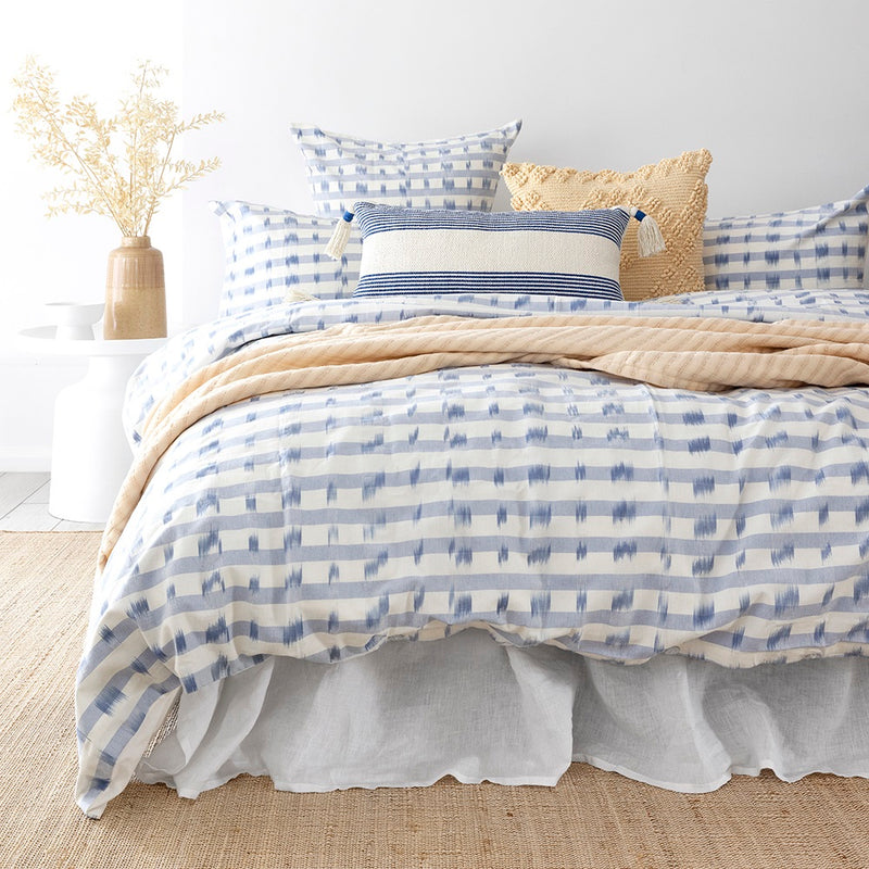 Bambury's Amara light blue patterned cotton quilt cover set with neutral throw blanket and decor cushions