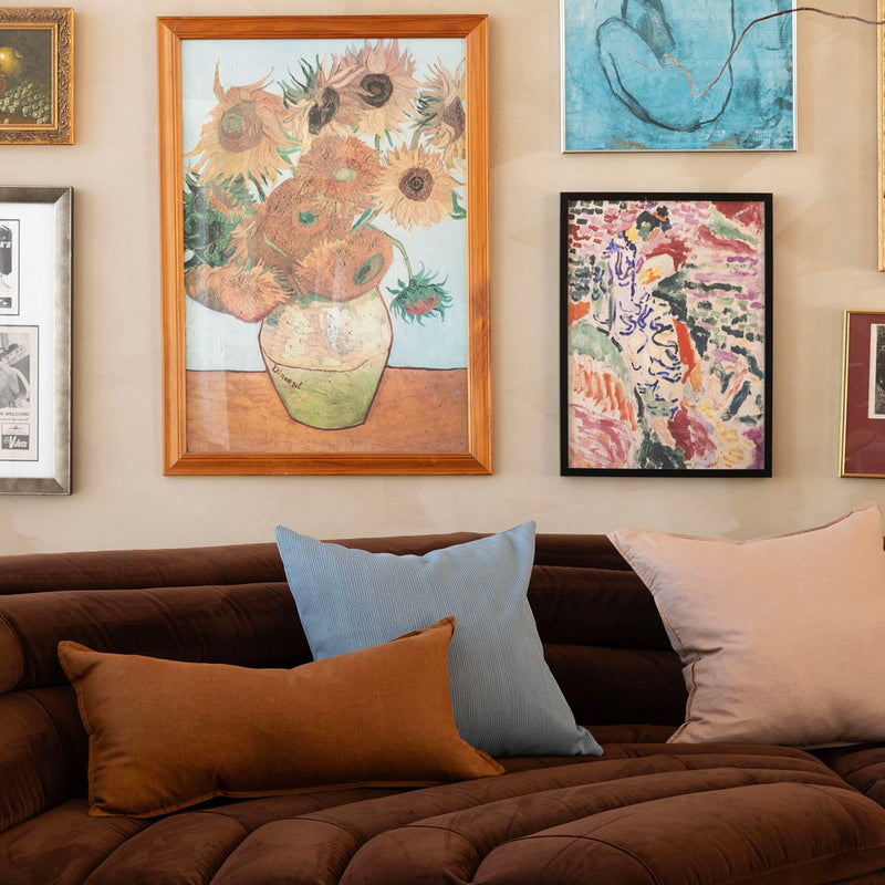 Bambury's Eva Square Cushion in Blue with linen cushions on a corner sofa