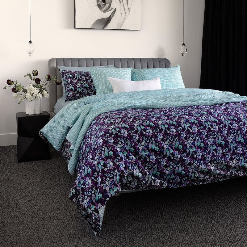 Bambury's Evelyn purple-blue floral print cotton quilt cover set with light blue throw blanket and decor cushions